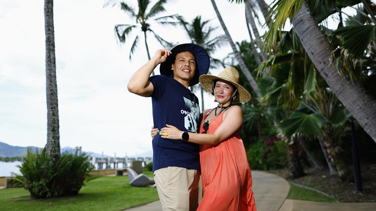 Cairns is currently experiencing heat wave conditions, with the temperature forecast to peak on Wednesday before Far North Queensland gets a slight reprieve. Colombian tourists Hans Ortiz and Maria Toro do their best to keep cool by wearing wide brim hats and loose clothing while walking along the Cairns Wharf foreshore in the hot and humid weather. Picture: Brendan Radke