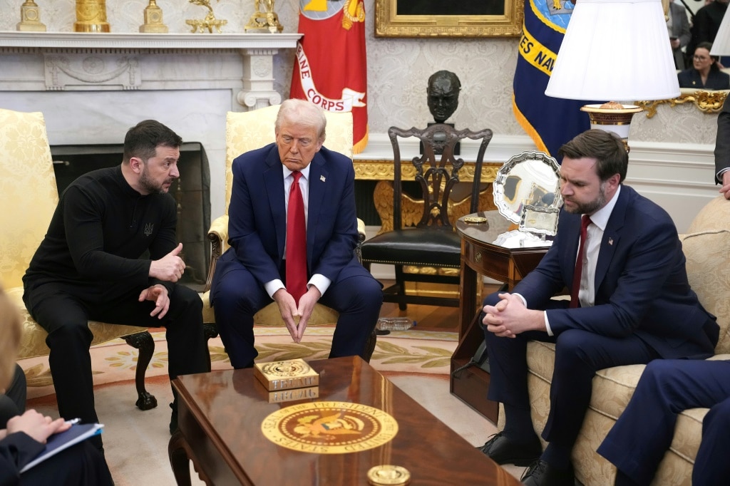 US President Donald Trump (C) and Vice President JD Vance (R) meet with Ukrainian President Volodymyr Zelensky (L) in the Oval Office on February 28, 2025