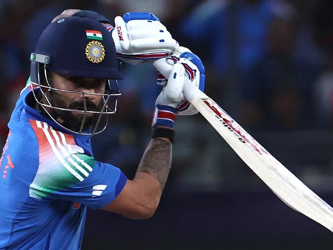 India's Virat Kohli watches the ball after playing a shot during the ICC Champions Trophy one-day international (ODI) semi-final cricket match between Australia and India at the Dubai International Stadium in Dubai on March 4, 2025. (Photo by FADEL SENNA / AFP)