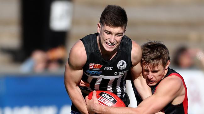 Joe Atley, left, in action for Port in the SANFL. Picture: Calum Robertson