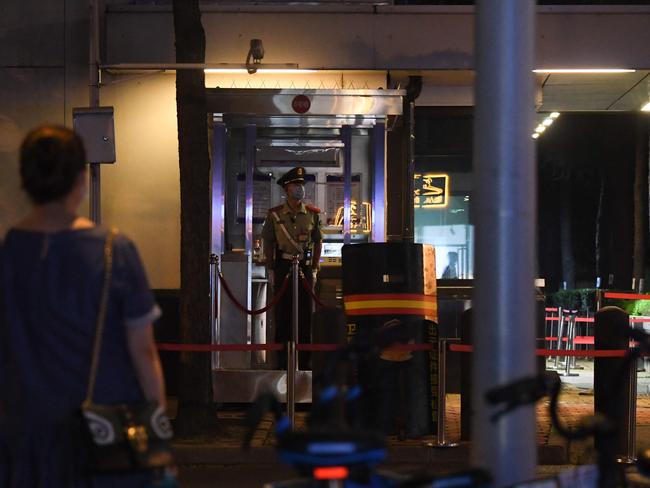 A policeman stands guard at the entrance to the US consulate in Chengdu. Picture: AFP