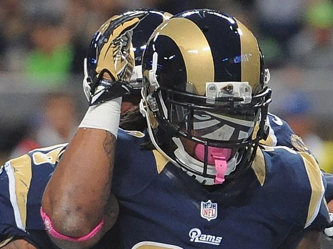 ST. LOUIS, MO - OCTOBER 19: Tre Mason #27 of the St. Louis Rams celebrates a first-quarter touchdown against the Seattle Seahawks at the Edward Jones Dome on October 19, 2014 in St. Louis, Missouri. Michael B. Thomas/Getty Images/AFP == FOR NEWSPAPERS, INTERNET, TELCOS & TELEVISION USE ONLY ==