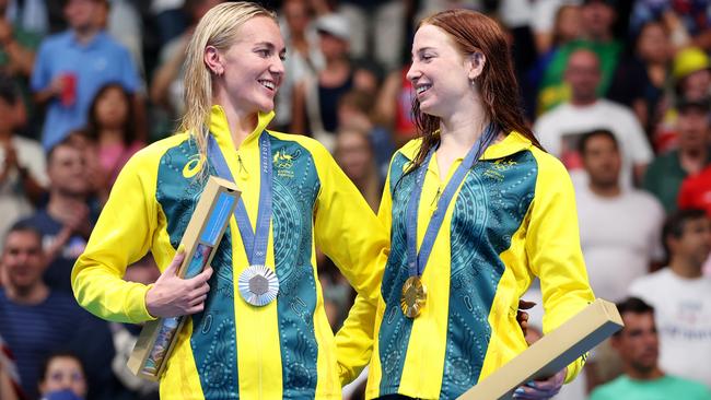 Mollie O’Callaghan with training partner Ariarne Titmus on the podium on Tuesday morning AEST. Picture: Getty Images