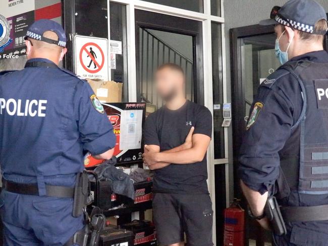 Operation Hawk officers speak to a man during their blitz. Picture: NSW Police