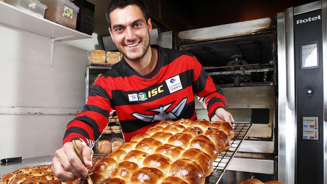 Lauderdale forward Phillip Bellchambers is up to his elbows in flour this week pumping out hot cross buns for Easter. Picture: Zak Simmonds