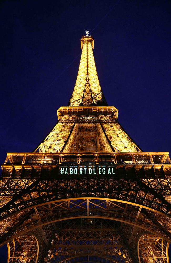A message reading in Spanish 'Abortion legal' is projected onto the Eiffel Tower after the French parliament voted to anchor the right to abortion in the country's constitution.