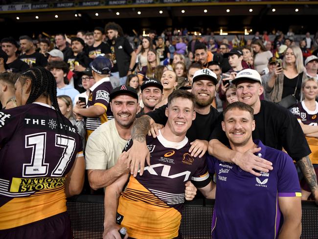 Josh Rogers celebrates with friends and family after his NRL debut in round 27, 2023.