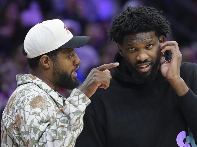 PHILADELPHIA, PENNSYLVANIA - NOVEMBER 2: Paul George #8 of the Philadelphia 76ers talks to Joel Embiid #21 during a timeout in the game against the Memphis Grizzlies in the first half at the Wells Fargo Center on November 2, 2024 in Philadelphia, Pennsylvania. NOTE TO USER: User expressly acknowledges and agrees that, by downloading and/or using this photograph, user is consenting to the terms and conditions of the Getty Images License Agreement. (Photo by Mitchell Leff/Getty Images)