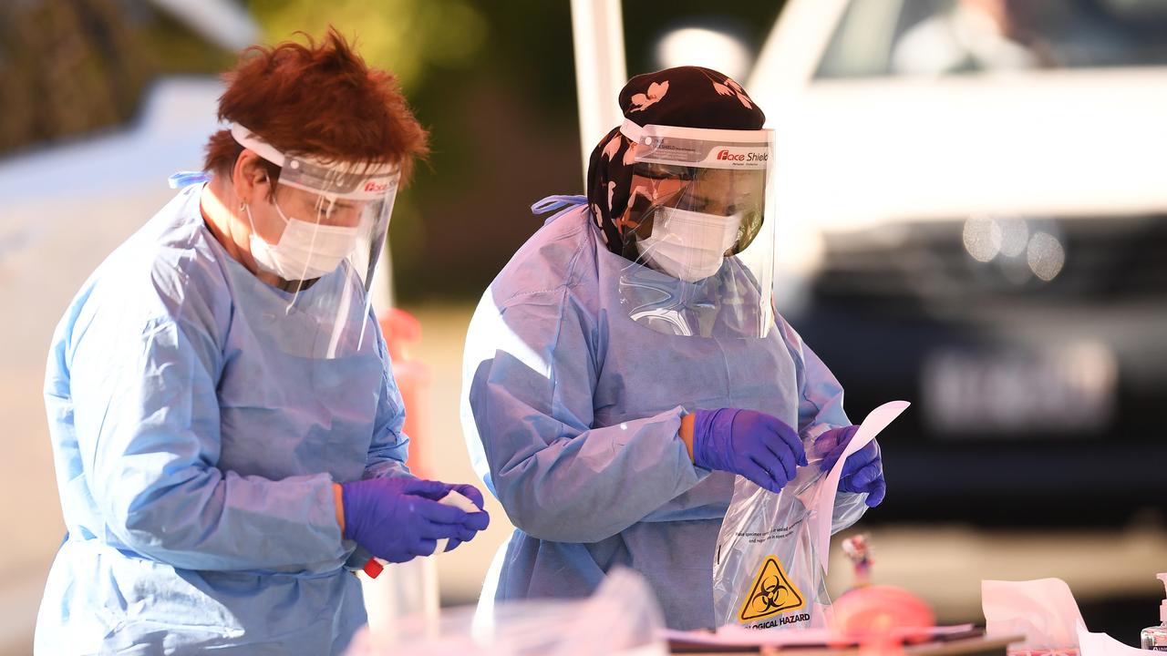 Health workers perform duties at a pop up Covid-19 testing clinic. Picture: NCA NewsWire / Dan Peled