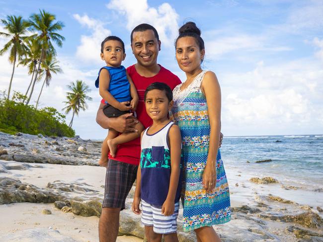 14th November 2018.Nauruan family Maverick and Ziki Eoe and their sons Nadal and Texas pose for a photograph on a Nauru beach.Photo: Glenn Hunt / The Australian