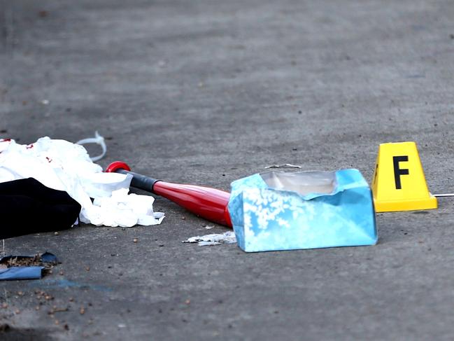 Items left at a crime scene include a baseball bat tee shirt cap beads and cable ties fashioned into handcuffs. Police bag these items for investigation . The attack accoured on Marsh st & Flora st  Arncliff . Pic John Grainger