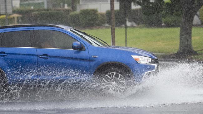 Traffic at the intersection of James and Kitchen Sts as rain continues to fall in Toowoomba in the aftermath of TC Alfred, Sunday, March 9, 2025. Picture: Kevin Farmer