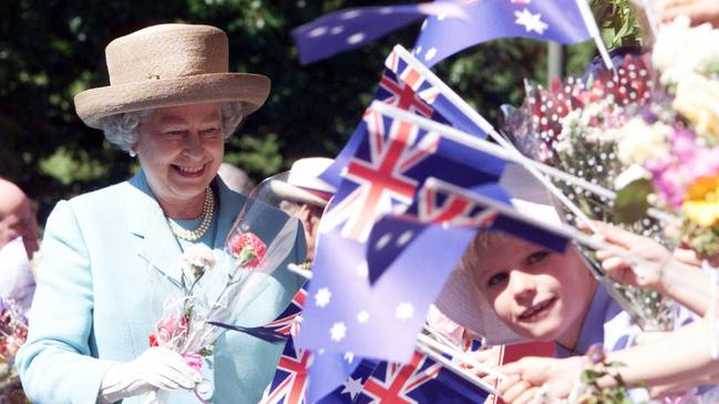 Queen Elizabeth II smiles on her royal walkabout in Launceston, Tasmania, Wednesday, March 29, 2000. Flag waving children welcomed her highness on arrival. Picture: AP Photo/News Corp