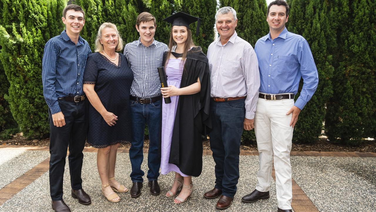 Bachelor of Business and Bachelor of Commerce graduate Katelyn Beresford with (from left) Bailey Beresford, Helen Beresford, Jacob Luck, Tony Beresford and Darcy Beresford at the UniSQ graduation ceremony at Empire Theatres, Tuesday, December 13, 2022. Picture: Kevin Farmer