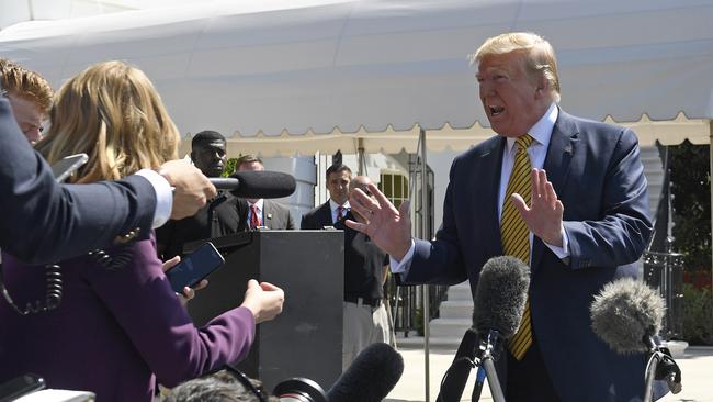 President Donald Trump speaks to reporters on the South Lawn of the White House in Washington on Saturday.