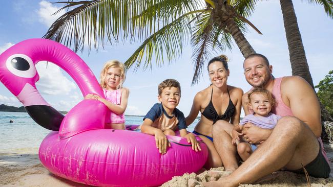 Lauren and Dom Geeves enjoy a pre Easter getaway with their children Ariana 4, Zane 6, and Abigail 18 months, on the beach at Noosa River Holiday Park. Picture: Lachie Millard