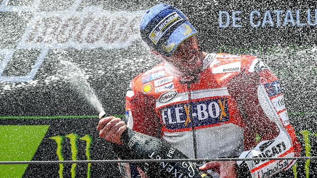 MONTMELO, SPAIN - JUNE 11:  Andrea Dovizioso of Italy and Ducati Team celebrates on the podium after winning the MotoGp of Catalunya at Circuit de Catalunya on June 11, 2017 in Montmelo, Spain.  (Photo by David Ramos/Getty Images)