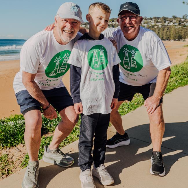 Mark and Wayne Bayfield, with Jacob, who designed the logo for the 'Lighthouse to Lighthouse' walk in September to raise money for the Children's Cancer Institute. Picture: Gabriella Sukkarr