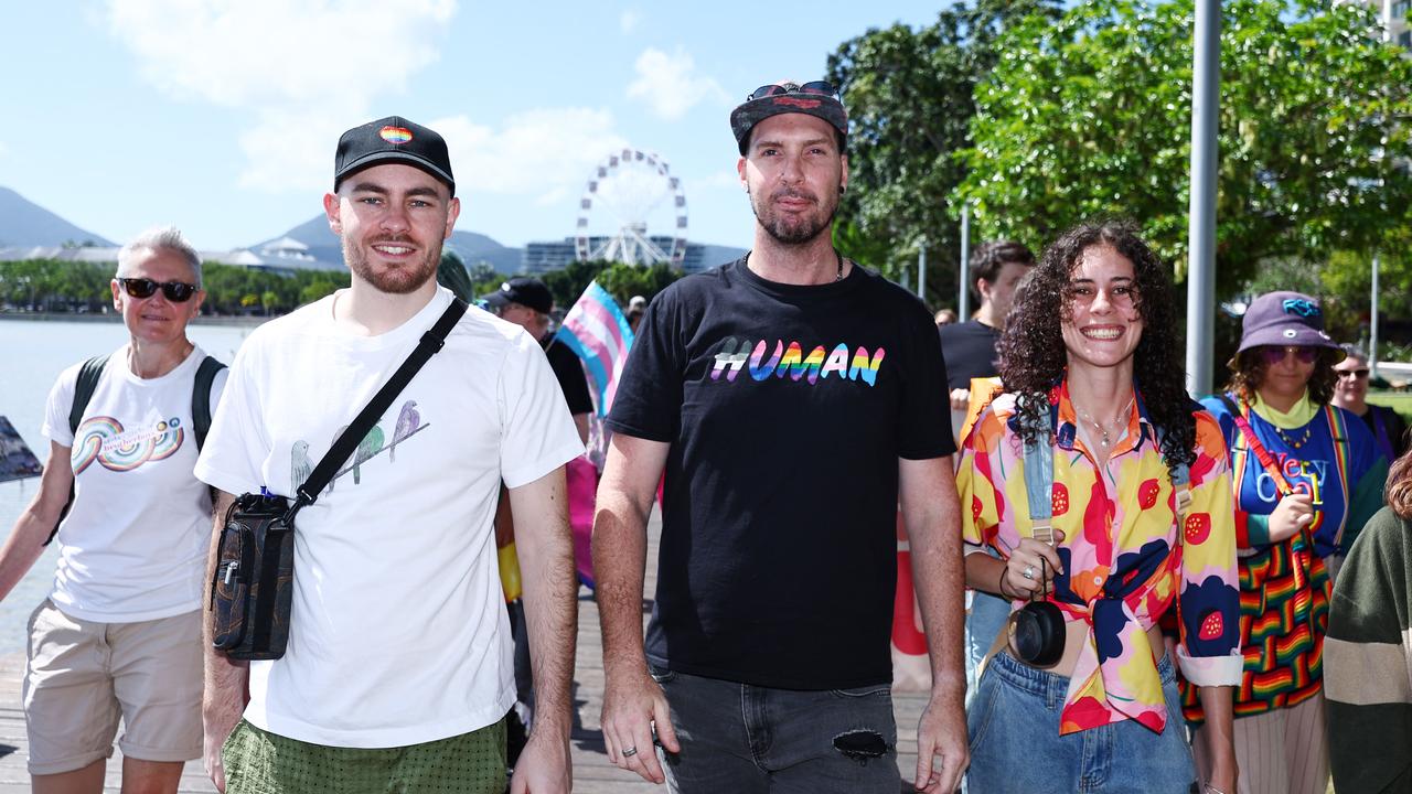 David Garozzo-Vaglio, Adrian Poole and Baylee O'Grady march along the Cairns Esplanade for the Pride Stride on Saturday, part of the 2024 Cairns Pride Festival. Picture: Brendan Radke