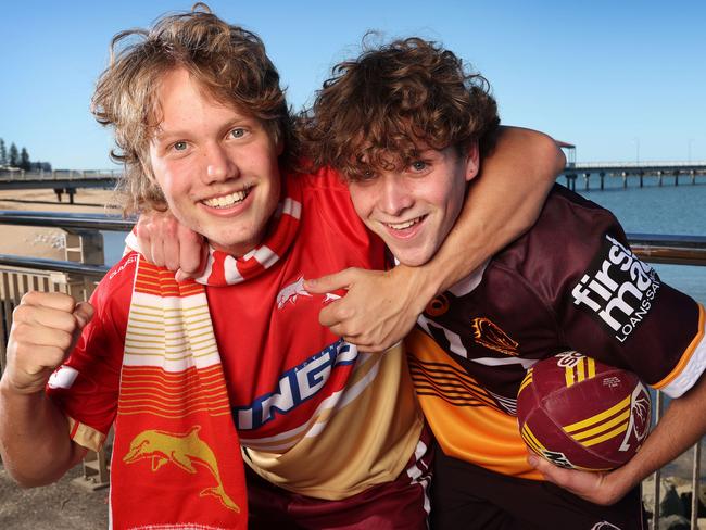 Nick Cummings, 15, supports the Dolphins but brother Charlie Cummings, 17 supports the Broncos, Redcliffe. Picture: Liam Kidston