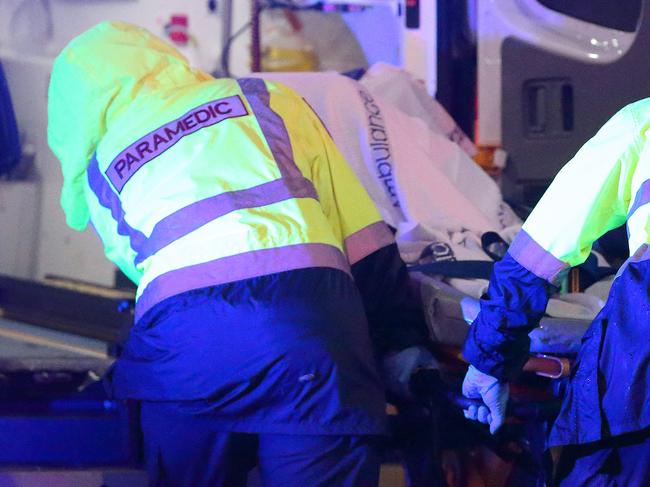 MELBOURNE, VICTORIA - OCTOBER 30: Person is loaded into ambulance. 207 Flinders Street (Flinder St Station, tram stop) on October 30, 2017 in Melbourne, Victoria. (Photo by Patrick Herve) Fees Exist.