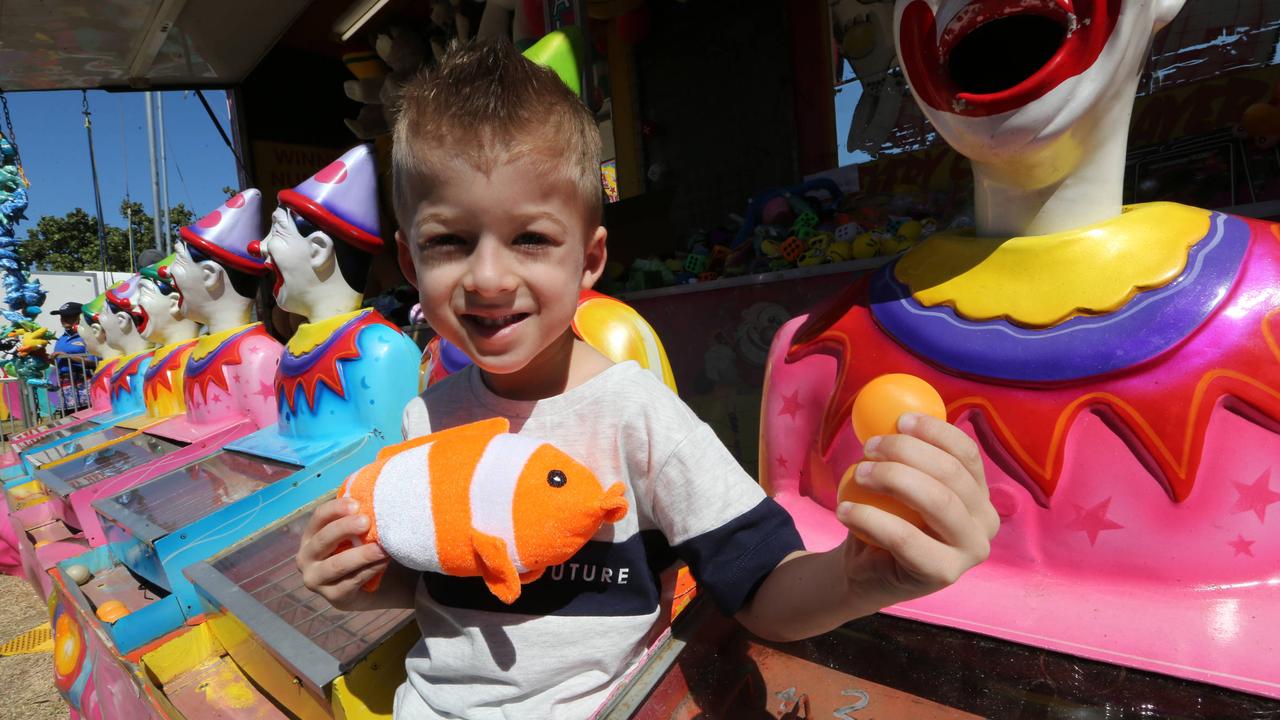 Five-year-old Mason Hamilton with his stuffed fish and laughing clowns at the Gold Coast Show. Picture: Mike Batterham