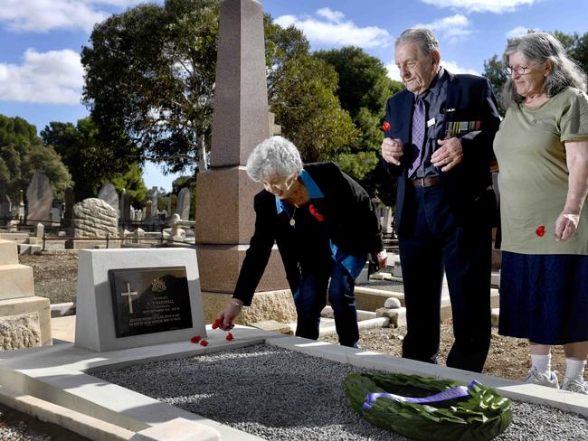 Monday 26 April, 2021 - Family members of Private Andrew James Marshall Ã his grandchildren (L-R) Joy Parker (89), Ron Wallace (aged 90) and Robyn Wallace (73) at the  graveside of their grandfather, after a long quest to have his war service recognised. Private Marshall died on 25 September 1914 (aged 29) after contracting pneumonia at Morphettville Camp. He was buried in an unmarked grave. Picture - Naomi Jellicoe