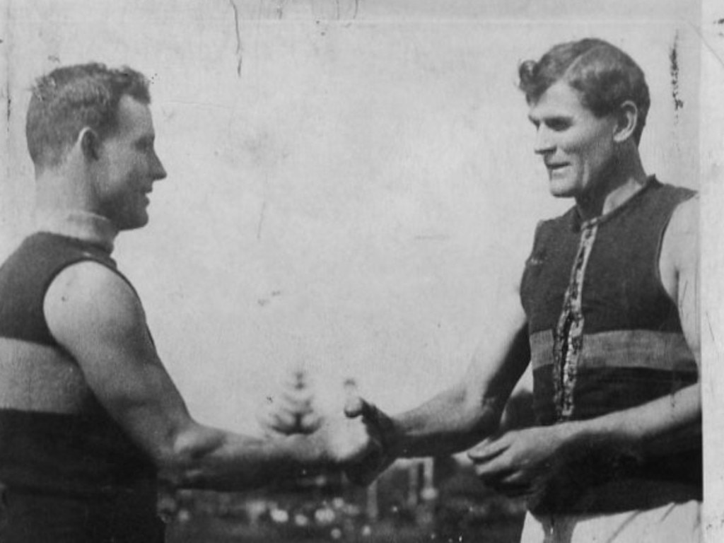 SA football - Bill Mayman and Tom Leahy, Sturt and North Adelaide captains, shake hands before the memorable challenge grand final of 1919.