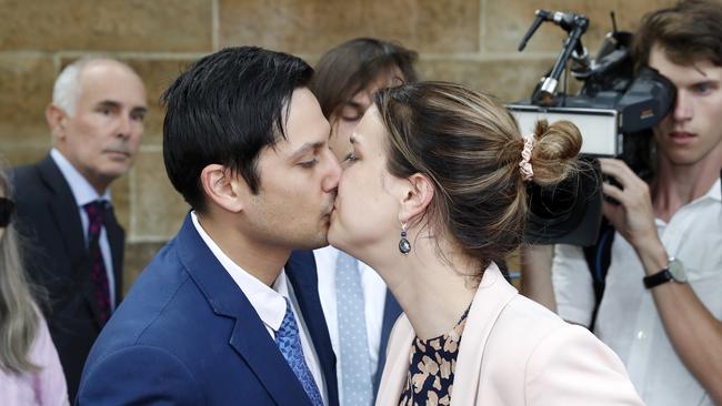 Blake Davis and his partner Hannah Quinn share a kiss outside Darlinghurst Courthouse. Picture: Jonathan Ng