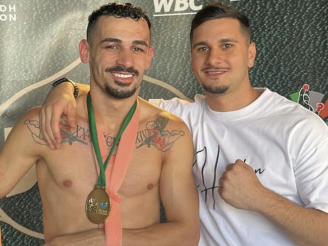 Hass Hamdan in a sling with his brother Moey after his heroic performance. Picture: Supplied