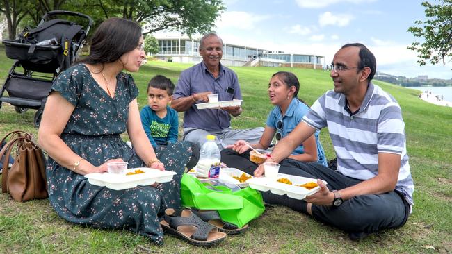 Ankit and his family enjoy Australia Day on the banks of Lake Burley Griffin in Canberra. Picture: Noah Yim