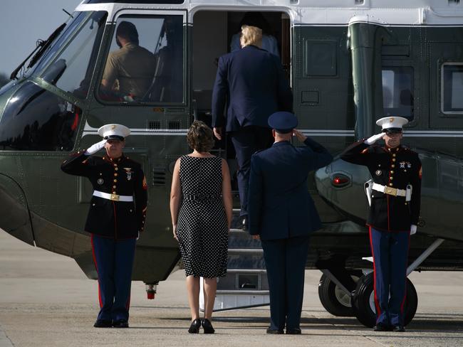 President Donald Trump follows first lady Melania Trump onto the Marine One helicopter. Picture: AP