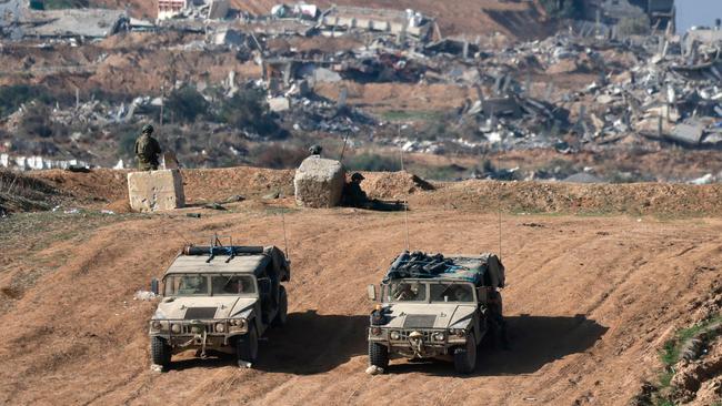 Israeli military vehicles patrol the border with Gaza on December 25. Picture: Menahem Kahana/AFP