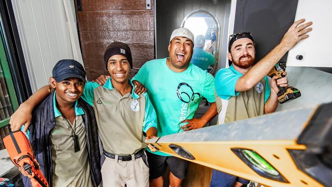 Tiny Homes, charity working with troubled youth and the Courier Mail Children's fund building a tiny home to be given away. Joseph Te Puni-Fromont with Ari Rasheed, 16 (hat), Simi Toru, 16 (Beenie) and Lenny Stone, 23. Picture: Nigel Hallett