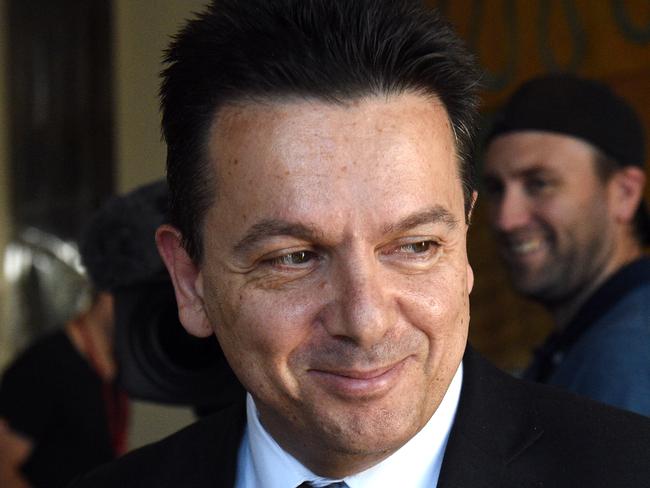 Independent Senator Nick Xenophon leaves after speaking at a press conference at Parliament House in Canberra on Thursday, April 21, 2016. (AAP Image/Mick Tsikas) NO ARCHIVING