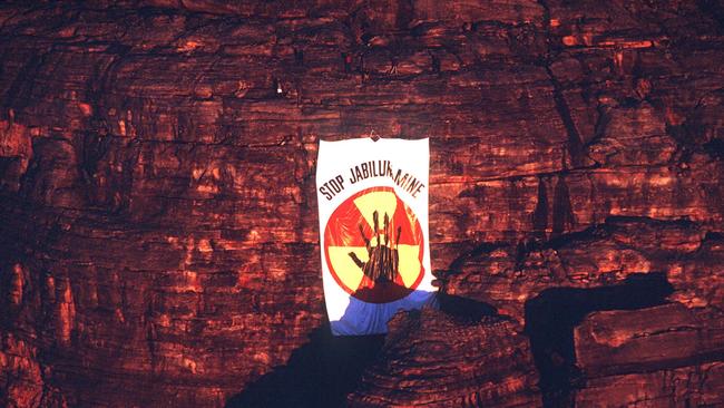 Ten Mirarr Traditional Owners dropped a giant 'Stop Jabiluka Mine' banner from a cliff face overlooking Oenpelli Rd in June 1997. Picture: Supplied