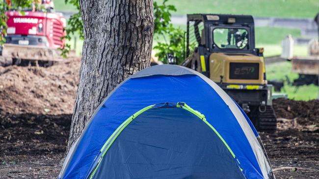 Tents in a well established homeless encampment in inner city Brisbane have been slapped with eviction notices by the local council, while landscaping works occur around their tents. Picture: NewsWire / Glenn Campbell