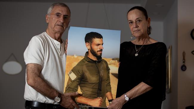 Yossi and Adva Grushka with a photo of their son, IDF soldier Tal Grushka, who was killed on October 7. Picture: Liam Mendes