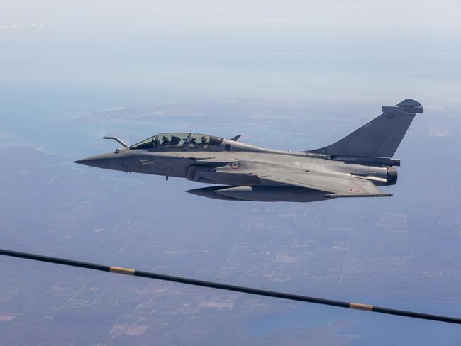 A French Rafale jet refuels mid-air about 100km south of Darwin. Picture: Floss Adams.