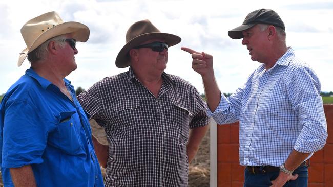 Minister for Primary Industries Tony Perrett (right) with cane farmer Stephen Accornero and Hinchinbrook Mayor Ramon Jayo in the immediate aftermath of the North Queensland flood disaster in February. The minister says more Queensland farmers will be able to access support under the joint Commonwealth-state Disaster Recovery Funding Arrangements (DRFA). Picture: Cameron Bates