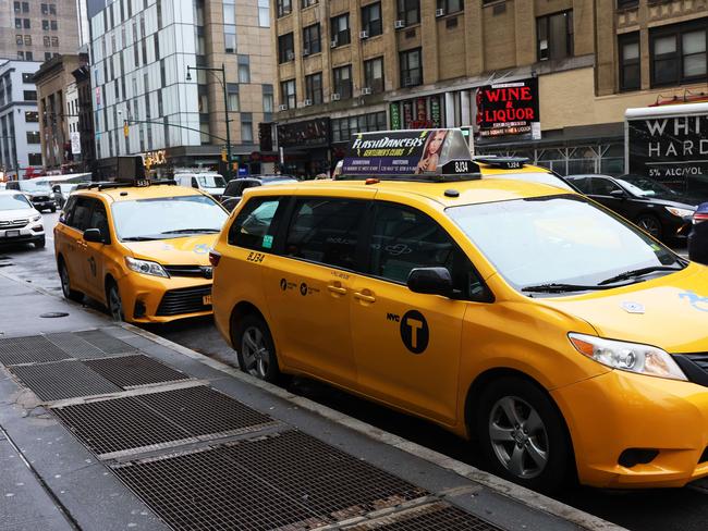 NEW YORK, NEW YORK - MARCH 24: A yellow cab taxi is seen on March 24, 2022 in New York City. Uber announced that it will begin to list all New York City taxis through its app starting this spring to a limited number of users before a full roll out in the summer. Uber spokesperson Conor Ferguson said that customers will be paying roughly the same amount for taxi rides as they would for Uber X rides and that the cityâs some 14,000 cabbies will be able to see what a trip will pay before they decide whether to accept it, something the Uber drivers in New York cannot do.   Michael M. Santiago/Getty Images/AFP == FOR NEWSPAPERS, INTERNET, TELCOS & TELEVISION USE ONLY ==