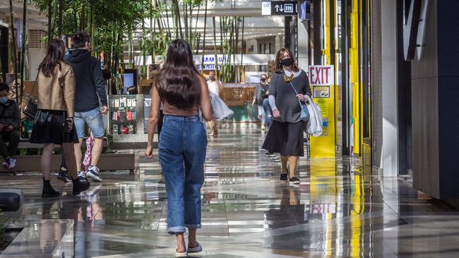 Shoppers enjoy the re-opened stores at Chadstone shopping centre. Picture: Jake Nowakowski