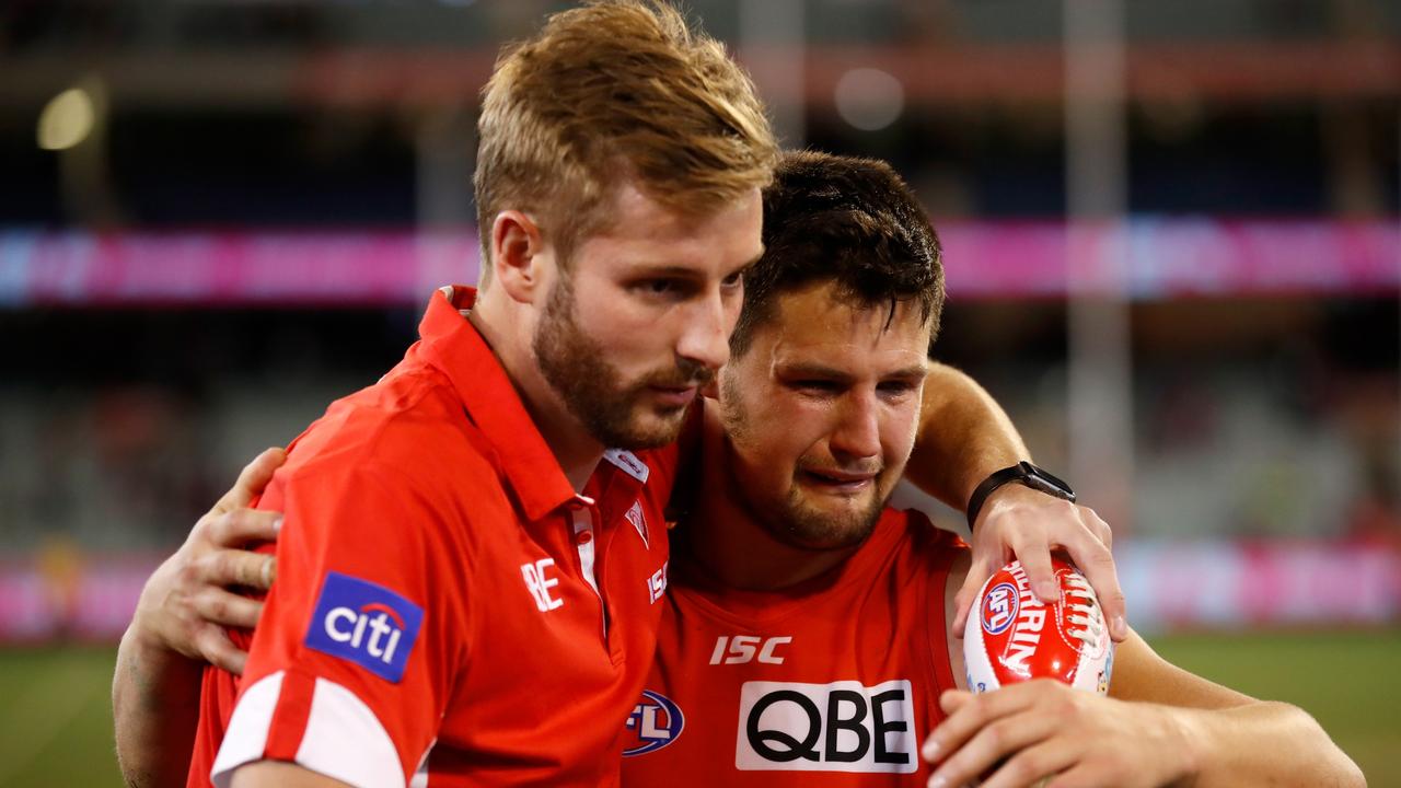 Alex Johnson and Nic Newman of the Swans embrace after Sydney’s win over Melbourne. (Photo by Michael Willson/AFL Media)