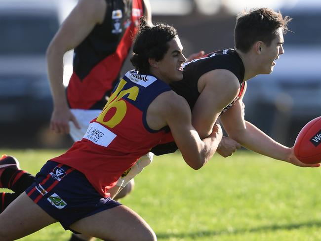 Corey Wright and Michael Sahlberg in action during the RDFL football match between Diggers Rest and Riddell in Diggers Rest, Saturday, April 28, 2018. (Picture/Andy Brownbill)