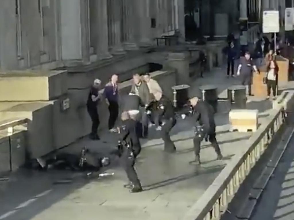 In this grab taken from video, police surround the suspected terrorist on London Bridge. Picture: (@HLOBlog via AP