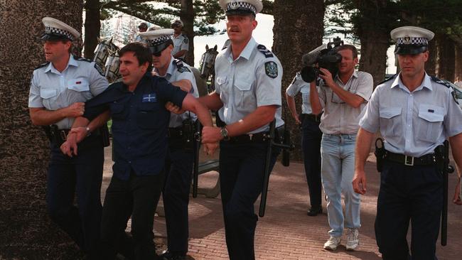 National action leader, Michael Brander is arrested by police at Glenelg in 1995. Picture: File