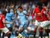 MANCHESTER, ENGLAND - NOVEMBER 02: Sergio Aguero of Manchester City is closed down by Daley Blind, Marouane Fellaini and Luis Antonio Valencia of Manchester United during the Barclays Premier League match between Manchester City and Manchester United at Etihad Stadium on November 2, 2014 in Manchester, England. (Photo by Laurence Griffiths/Getty Images)