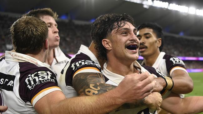 TOWNSVILLE, AUSTRALIA - AUGUST 10: Kotoni Staggs of the Broncos  celebrates after scoring a try during the round 23 NRL match between North Queensland Cowboys and Brisbane Broncos at Qld Country Bank Stadium, on August 10, 2024, in Townsville, Australia. (Photo by Ian Hitchcock/Getty Images)