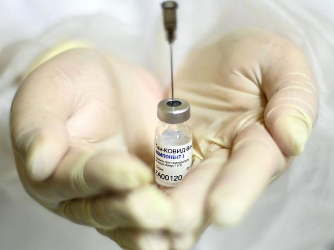 A nurse shows the Sputnik V (Gam-COVID-Vac) vaccine against the coronavirus disease (COVID-19) at a clinic in Moscow on December 5, 2020, amid the ongoing coronavirus disease pandemic. - Russian President has told authorities to begin "large-scale" vaccinations among at-risk populations. The drugs should be made generally available to the Russian public in early 2021. (Photo by Kirill KUDRYAVTSEV / AFP)