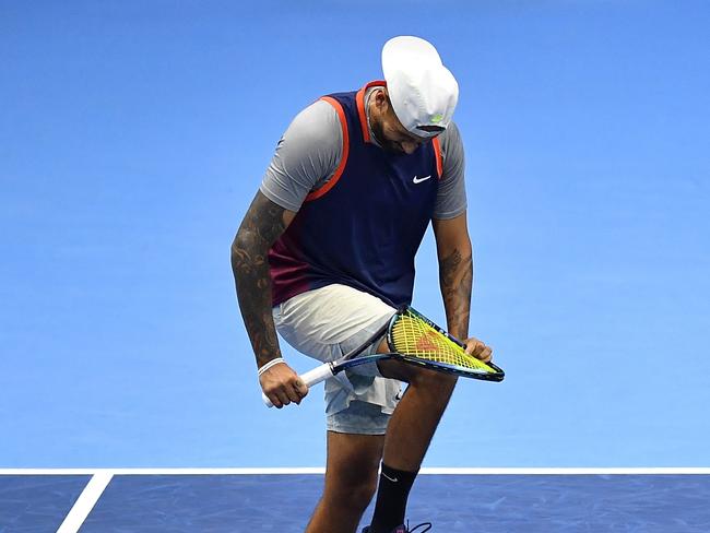 TURIN, ITALY - NOVEMBER 18:  Thanasi Kokkinakis of Australia (out of frame) and Nick Kyrgios of Australia breaks the racket while playing Nikola Mektic of Croatia and Mate Pavic of Croatia in the doubles round robin during day six of the Nitto ATP Finals at Pala Alpitour on November 18, 2022 in Turin, Italy.  (Photo by Valerio Pennicino/Getty Images)